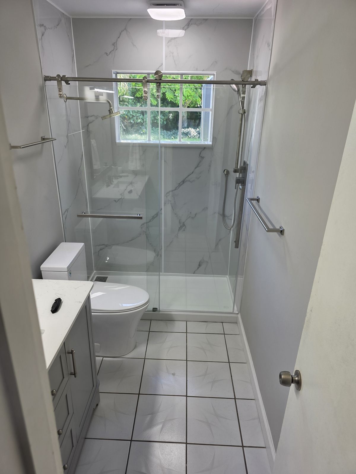 Guest Bath with Glass Shower by M&M Builds