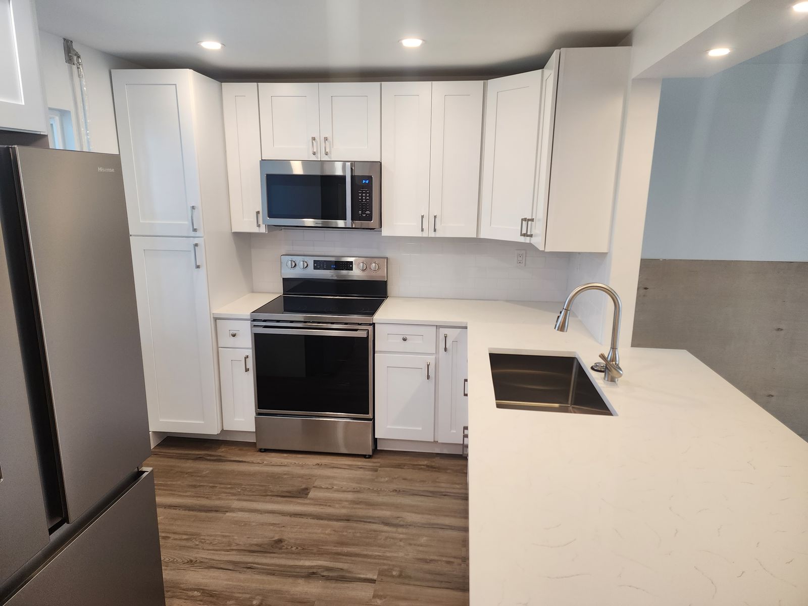 Finished condo kitchen by M&M Builds